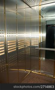 modern high-speed elevator with mirrors
