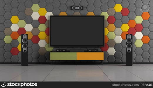 Modern home cinema system with flat tv against colorful acoustic panels - 3d rendering. Colorful room with home cinema system