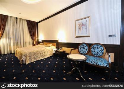 modern hotel room appartment indoor with double bed and lcd tv