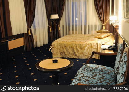 modern hotel room appartment indoor with double bed and lcd tv