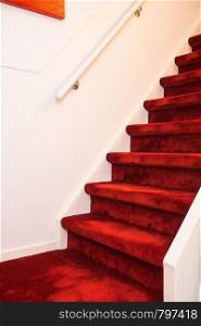 Modern Indoor Marble Staircase With Red Carpet and white wall. Modern Indoor Marble Staircase With Red Carpet.