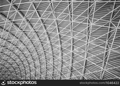 Modern interior architecture of metal steel roof structure of airport or industrial factory.