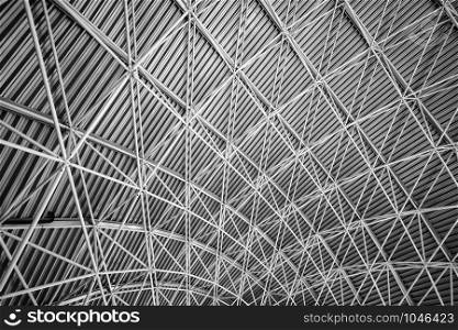 Modern interior architecture of metal steel roof structure of airport or industrial factory.
