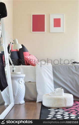 modern kids bedroom with red pillows and shoes at home
