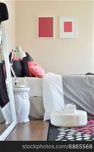 modern kids bedroom with red pillows and shoes at home