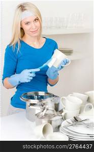 Modern kitchen - happy woman washing dishes, housework
