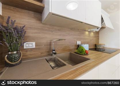 modern kitchen interior with vegetables and lavender
