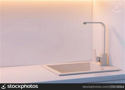 Modern kitchen with white countertop and white sink. High quality photo.. Modern kitchen with white countertop and white sink. High quality photo