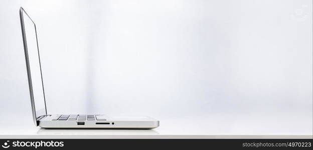 Modern laptop computer. Modern laptop computer on white background, rear view