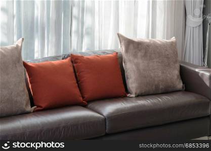 modern living room design with sofa and red pillows