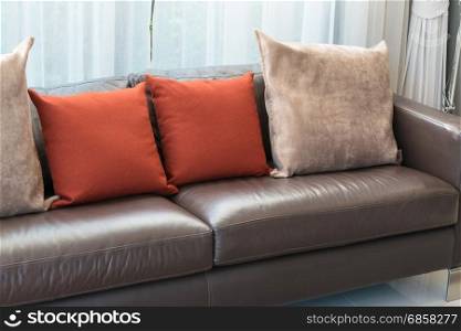 modern living room design with sofa and red pillows