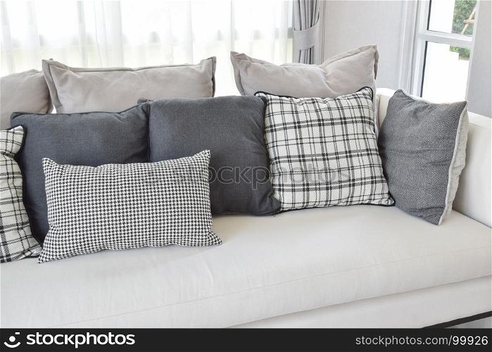 modern living room interior with black and white checked pattern pillows on sofa
