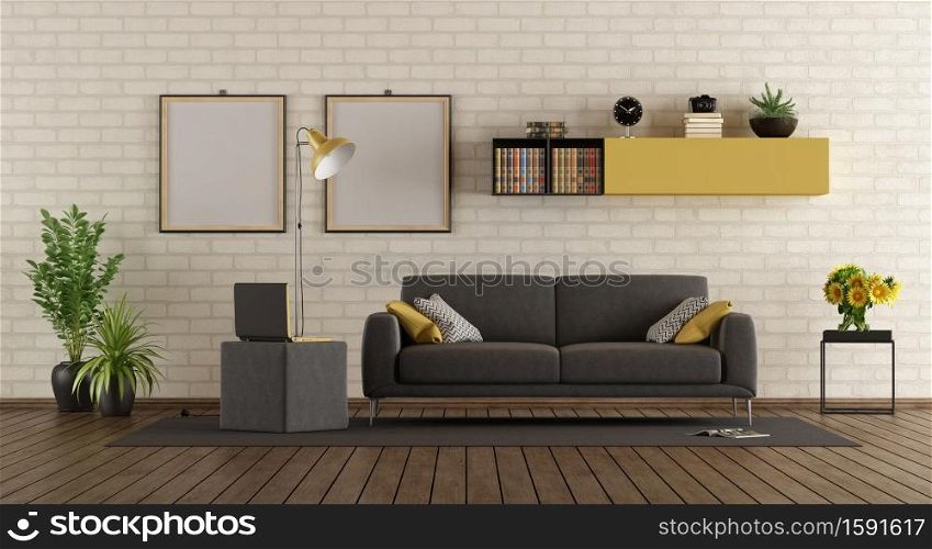 Modern living room with gray sofa,laptop on footstool and brick wall - 3d rendering. Modern living room with sofa and brick wall