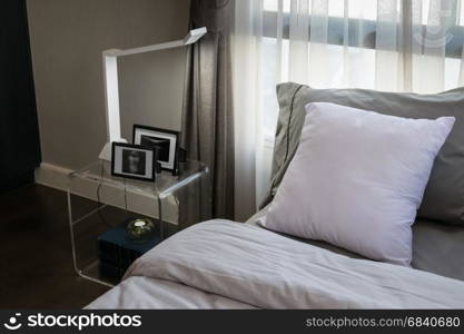 modern luxury bedroom with pillows and lamp