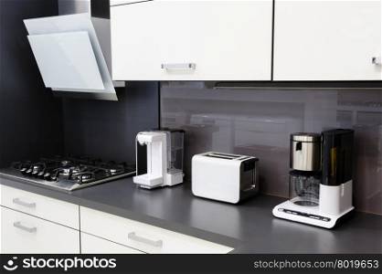 Modern luxury black and white kitchen in high tech style