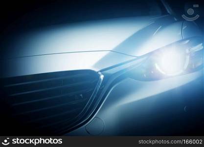 Modern luxury car close-up background. Concept of expensive, sports auto.. Modern luxury car close-up background