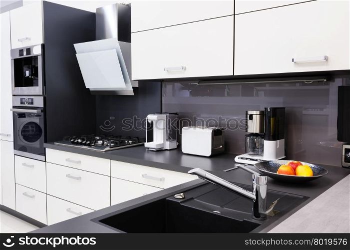 Modern luxury hi-tek black and white kitchen, clean interior design