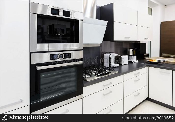 Modern luxury hi-tek black and white kitchen interior, clean design