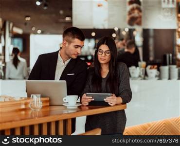 modern man and woman use modern devices, laptop, tablet and smartphone and arrange new projects for the job. modern man and woman use modern devices, laptop, tablet and smartphone and arrange new projects for the job. Business concept .