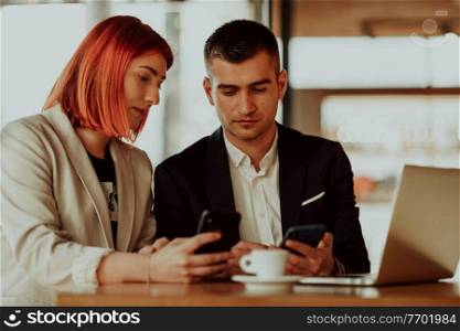 modern man and woman use modern devices, laptop, tablet, and smartphone and arrange new projects for the job. modern man and woman use modern devices, laptop, tablet and smartphone in coffe shop 