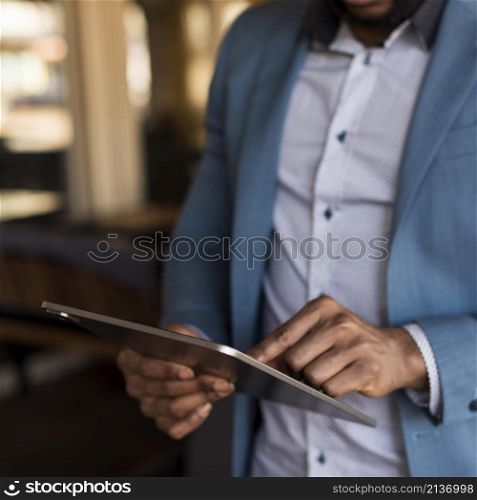 modern man looking his tablet
