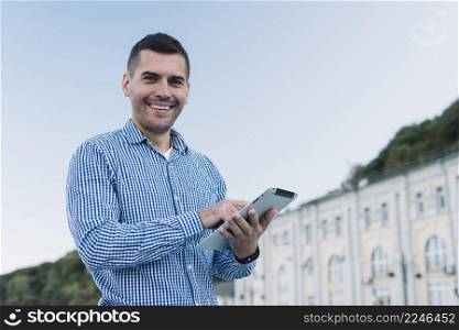 modern man with tablet urban environment