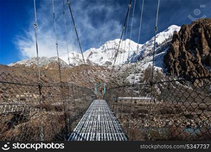 Modern metal bridge in Manang, Himalaya, Nepal