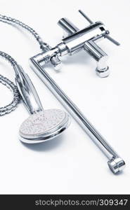 modern metal faucet and shower close up