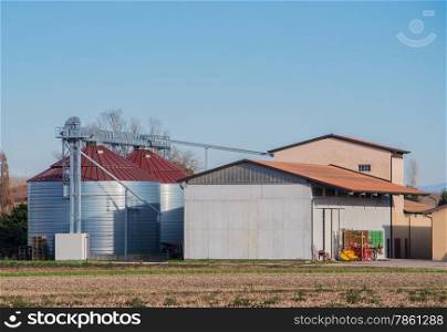 Modern metal silo with blue sky background