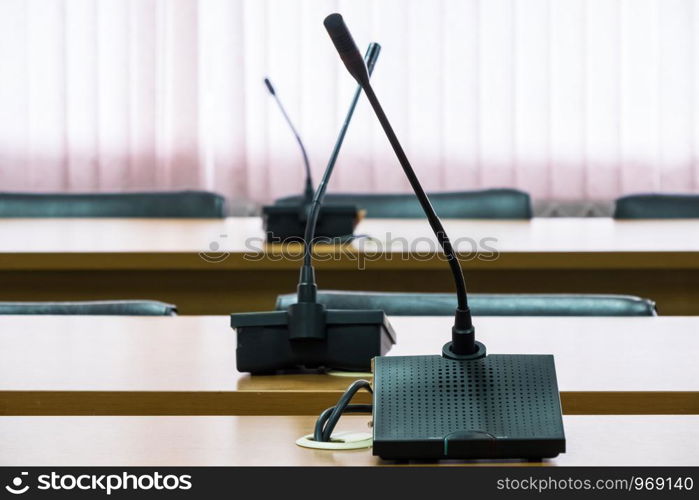 Modern microphone for conference time in the meeting room of the business center.