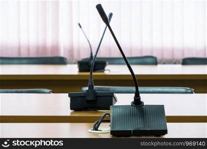 Modern microphone for conference time in the meeting room of the business center.