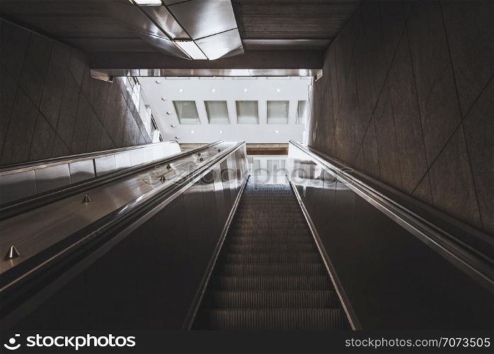 Modern moving stairs from an underground passage, going up towards the exit, in Stuttgart, Germany.