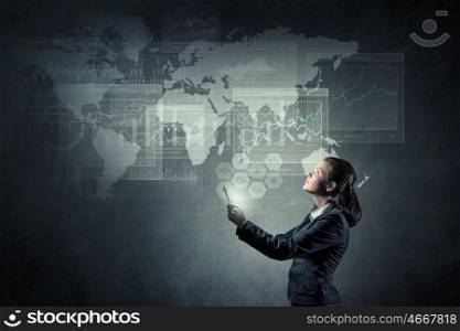 Modern multimedia technologies. Young businesswoman with tablet presenting innovative media technologies