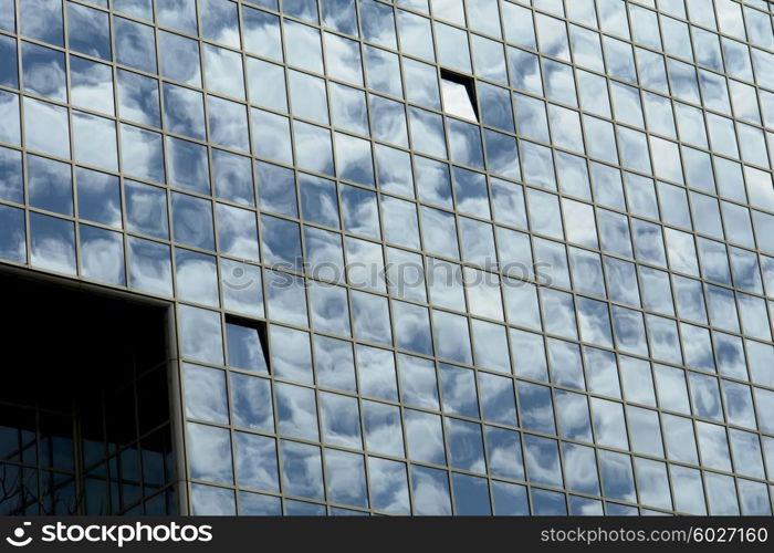 modern office building and the clouds reflection