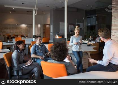 Modern office scene. Young business people discussing