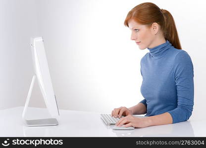 Modern office - young business woman work at computer