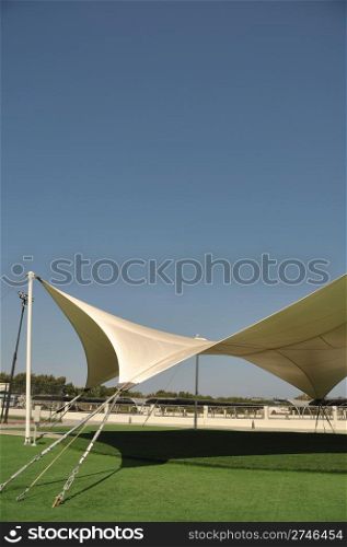 modern outdoor tent for recreational purposes (blue sky background)