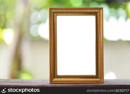 Modern Picture Frame placed on a wooden floor.. Modern Picture Frame placed on a wooden floor hand have copy space to work input your idea.