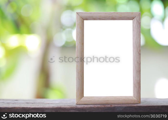 Modern Picture Frame placed on a wooden floor.. Modern Picture Frame placed on a wooden floor hand have copy space to work input your idea.