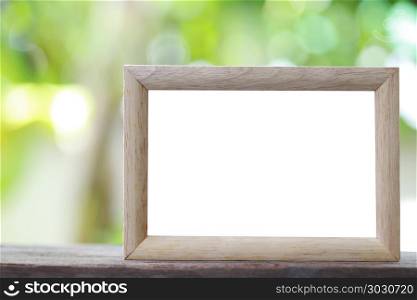 Modern Picture Frame placed on a wooden floor.. Modern Picture Frame placed on a wooden floor hand have copy space to work input your idea.