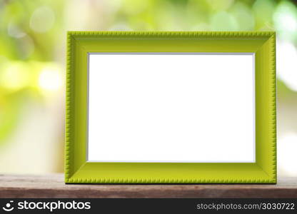 Modern Picture Frame placed on a wooden floor.. Modern Picture Frame placed on a wooden floor hand have copy space to work input your idea.