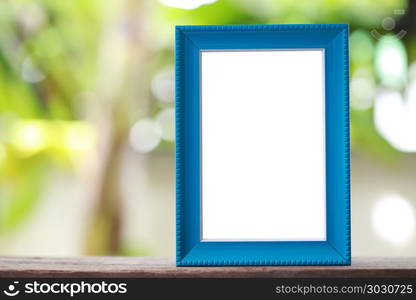 Modern Picture Frame placed on a wooden floor.. Modern Picture Frame placed on a wooden floor hand have copy space to work input your idea.