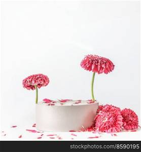 Modern product display with podium, pink flowers and petals at white background. Scene stage showcase. Front view with copy space.