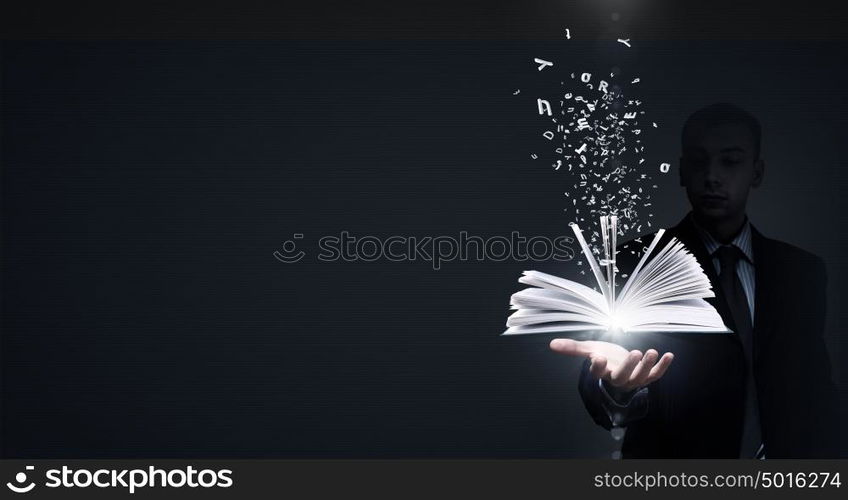 Modern reading. Close up of businessman showing media book on palm