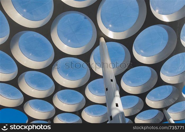 Modern roof with circle glass windows over passage near railway station Utrecht, the Netherlands. Modern roof with circle glass windows over passage shopping center
