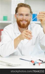 modern scientist working with pipette in biotechnology laboratory
