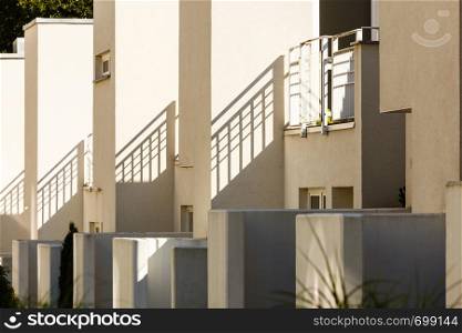 Modern semi detached houses in minimalistic shape, outdoor shot on sunny day.. Modern semi detached houses in minimalistic shape