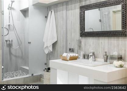 Modern shower room interior with washbasin and mirror. interior of the shower room