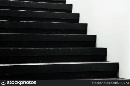Modern simple Black stairway steps with white wall detail - dark shadow monotone interior background image