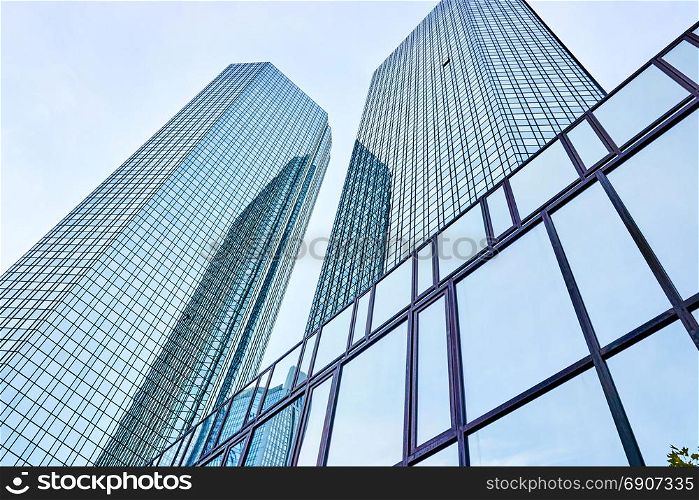 modern skyscrapers in business district against blue sky